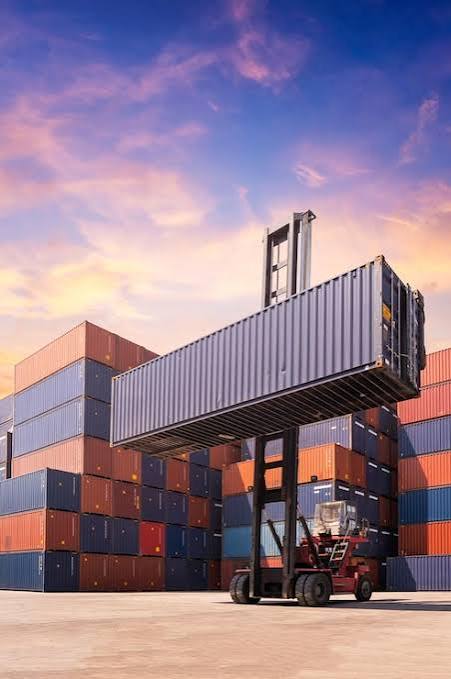 Container handling equipment lifting a container